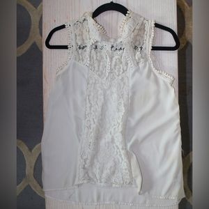 White Blouse, with lace design near chest.